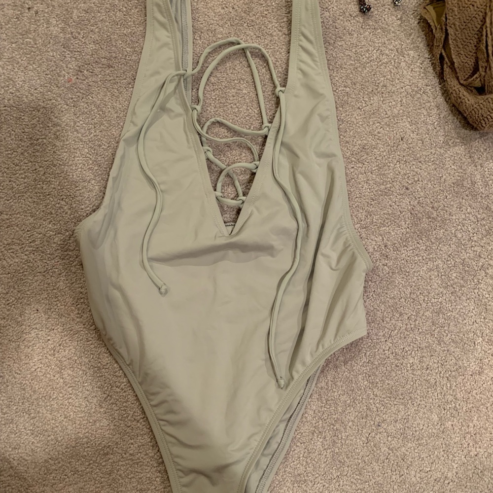 One piece cross from bikini